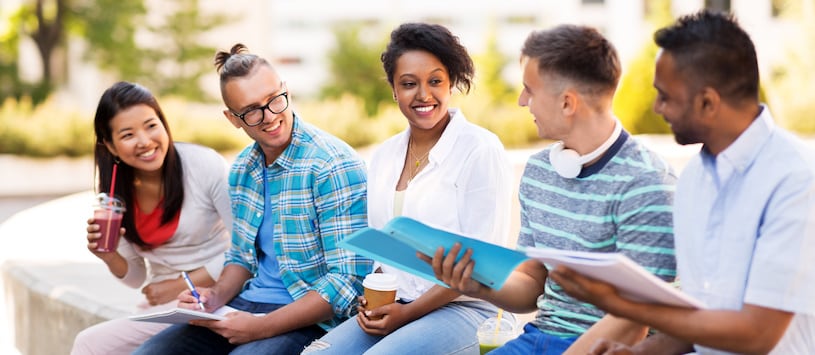 A group of multicultural students outside on campus