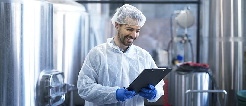 A man in a pharma lab. Take the Pharmaceutical Manufacturing Technologist Program at Oxford College.